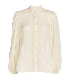 Find ZIMMERMANN Cotton Voile Halliday Blouse on Editorialist. Affirming the labels ever-present femininity, Zimmermann crafts the Halliday blouse with romantic lace panelling throughout. Cut from soft cotton, the piece is blossoming with a delightful summery aura thanks, in part, to its incredibly lightweight voile finish and balloon sleeves. Cream Tops For Fall Wedding, Cream Tops For Wedding In Fall, Elegant Off-white Blouse For Daywear, Elegant Off White Blouse For Daywear, Cream Feminine Blouson Sleeves Top, Feminine Cream Top With Blouson Sleeves, Feminine Cream Tops With Blouson Sleeves, Feminine Cream Blouse For Daywear, Elegant Off-white Blouse With Lace Trim