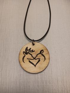 You are purchasing a handmade wood burned necklace. The necklace in the picture is the necklace you are getting. Each necklace is unique.  The wooden circle is 1.97 x 1.97 round x 0.08 inches thick. The wood is sealed with varnish to protect the necklace from fading or warping. The necklace rope can be adjusted from 24 inches to 26 inches with the extension chain. It is 2mm in diameter.  The necklace is string covered with black wax cotton cord and comes exactly as shown in the pictures. The metal on the necklace is Zinc Alloy. Deer Necklace, Wooden Circle, Necklace Rope, Wood Necklace, Handmade Wood, Cotton Cord, Waxed Cotton, Plymouth, Zinc Alloy