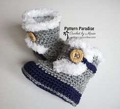 a pair of crocheted baby booties with buttons on the front and bottom