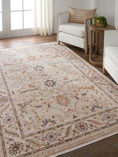 a beige rug with an ornate design on it