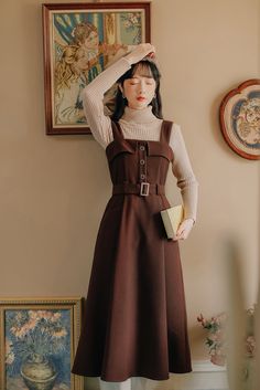 Midi pinafore dress with thick shoulder straps, button front, belted waist, side pockets and pleated skirt. Concealed back zipper. S: 33" chest, 27" waist, 42" lengthM: 34.5" chest, 28.5" waist, 42" lengthL: 36" chest, 30" waist, 42.5" lengthXL: 37.5" chest, 31.5" waist, 42.5" length Winter Dark Academia, Dark Academia Dress, Academia Dress, Preppy Style Women, Court Fashion, Midi Pinafore Dress, Winter Dark, Dresses Autumn, Cottagecore Fashion