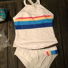 Cupshe Tankinj White With Rainbow Detail Racerback Style New With Tags And Liner Fits Like An Xl Casual White Halter Neck Tankini, Casual Striped Sleeveless Tankini, White Racerback Halter Top For Summer, White Stretch Racerback Swimwear, White Summer Halter Top With T-back, White T-back Halter Top For Summer, White Sleeveless Halter Top For Poolside, Casual Multicolor Halter Neck Tankini, White Racerback Swimwear For Summer