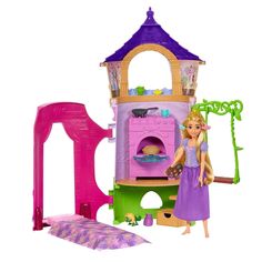 a doll house with a princess and her furniture in the front, on a white background