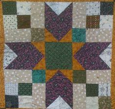 a close up of a quilt on the floor