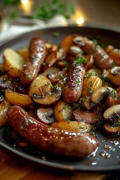 some sausages and potatoes on a plate with parsley sprinkled around them