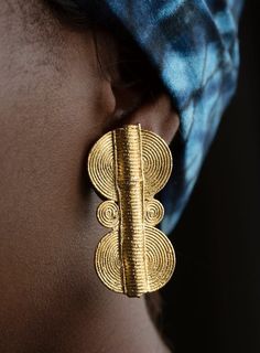 Gold plated earring. This accessory is handmade by artisans in the Ivory Coast. Instagram: Jewellassy_ Color: Gold Fabric: None Gender: For Her Earings: Balls ear clips Material: Steel Jewel Style: Statement pieces, Non-fabric pieces Ear Clips, Gold Fabric, Ivory Coast, Style Statement, Gold Plated Earrings, Statement Pieces, Ring Earrings, Gold Earrings, Gold Plate