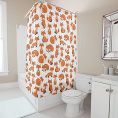 an orange and white shower curtain in a bathroom with corals on the shower curtain