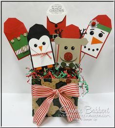 a gift bag filled with paper cut outs