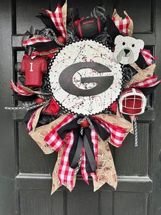 a football wreath is hanging on the front door