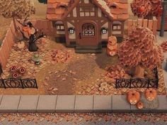 a fake house with pumpkins on the ground