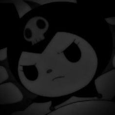 a black and white image of a cartoon character with eyes wide open in the dark