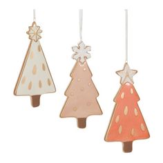 three wooden christmas trees hanging from strings