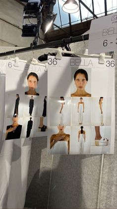 several pictures of women's clothing hanging on clothes pins in front of a light fixture