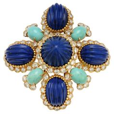 Van Cleef Lapis Lazuli & Turquoise Brooch Carved lapis lazuli and turquoise set with diamonds 18k yellow gold Signed Van Cleef and Arpels and numbered Measurements: 2.5" x 2.5" Blue Diamond Gemstone Brooches, Luxury Turquoise Brooches, Luxury Blue Brooch Jewelry, Luxury Blue Jewelry Brooch, Turquoise Brooch, Diamond Flower Brooch, Gold Vans, Van Cleef And Arpels Jewelry, Jewellery Diy