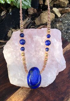 A lovely bright High quality Lapis Lazuli pendant, threaded on light brown macrame necklace, with brass beads and lapis lazuli beads. Adjustable length. Pendant is 2.8cm height x 1.8cm width   This is a lovely pendant, that can be worn with either side showing, as you can see in the pictures. both sides are very pretty. Features-  - Side-drilled polished Lapis Lazuli, height 2.8cm x 1.8cm width  -Lapis Lazuli round beads  -Vegan Waxed Cord - light brown - Brass beads. -Adjustable length, this ne Pretty Features, Macrame Gemstone, Brown Macrame, Lapis Lazuli Pendant, Lapis Lazuli Beads, Brass Beads, Sliding Knot, Macrame Necklace, Necklace Handmade