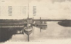 an old black and white photo of a boat in the water