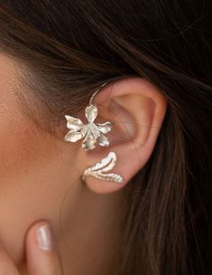 A beautiful handmade 925 sterling silver Earring These Orchid Floral Ear Cuff, earrings is made of excellent quality materials and is fully hypoallergenic & nickel free. It is also tarnish resistant. Ear cuffs are the coolest accessory at the moment! Cuff earrings embrace and flatter your ears, they make them look even more dainty and give you that feminine vibe you want. A simple pair of earrings that can be worn every day. Price is for Single Please see all photos and select the color you Dainty Sterling Silver Ear Climbers For Wedding, Sterling Silver Ear Climbers For Wedding, White Gold Sterling Silver Ear Climbers For Wedding, Dainty Silver Ear Cuff For Wedding, Sterling Silver Ear Cuff With Ear Wire For Weddings, Dainty Sterling Silver Ear Cuff With Matching Earrings, Handmade Elegant Ear Climbers, Sterling Silver Ear Cuff For Wedding, Unique Silver Wrap Earrings