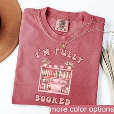 a t - shirt that says i'm funky booked with books on it