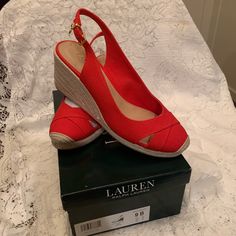 Beautiful Brand New In Box Lauren Ralph Lauren Slingback Wedge Sandals, Material Is Red Canvas With 2in Wedge Heel In Size 9b. These Have Never Been Worn And Come From Smoke Free, Pet Free Home. Complement Anything From Maxi Dresses To Cropped Jeans With These Hot Wedge Sandals From Lauren Ralph Lauren. The Espadrille Heel And Cap Toe Pair Perfectly. Nice Gold Emblem Hangs From Buckle. Make These Your New Warm Weather Go-To! Slip-on Wedge Sandals With Red Sole, Red Slingback Wedge Sandals For Summer, Red Cushioned Slip-on Wedge Sandals, Red Canvas, Ralph Lauren Shoes, Womens Shoes Wedges, Cropped Jeans, Lauren Ralph Lauren, Maxi Dresses