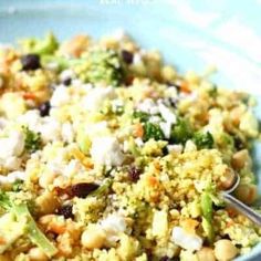 a blue bowl filled with rice and broccoli