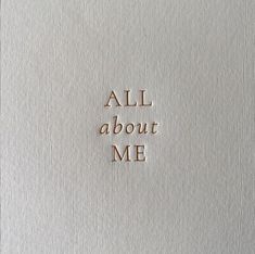 the words all about me written in gold foil