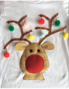 a white t - shirt with a reindeer head and christmas lights on it's chest