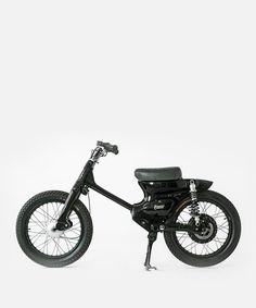 a black motorcycle is shown on a white background with the seat folded down and it's front wheel still in position