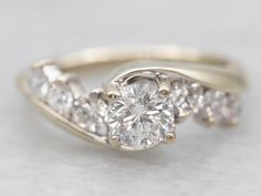 a diamond ring with three stones on it