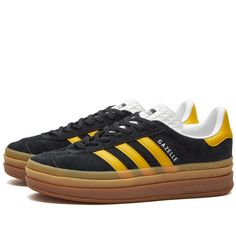 Find ADIDAS Gazelle Bold W Sneakers on Editorialist. Released in 1968, the adidas Gazelle was initially intended to be an all-round training shoe. Crafted with a minimal design and multiple colour combinations the Gazelle has been a firm favourite in the sports casual arena. Made with a suede upper, with three stripe detailing. Finished with a chunky rubber outsole Leather Upper, Synthetic Sole, Lace Closure, Rubber Outsole, Adidas. Adidas Women's GAZELLE BOLD W Sneakers in Core Black/Bold Gold/ Adidas Custom Sneakers With Contrast Sole For Sports, Adidas Custom Sneakers With Gum Sole For Sports, Adidas Bold, Adidas Gazelle Bold, Gazelle Bold, Sneaker Release, Casual Sneakers Women, Moon Boots, Denim Gift