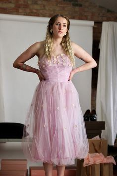 "Vintage 1950's pink tulle and taffeta strapless dress. No Label. The dress in a good vintage condition.  The dress has an opening on the left side, please see photo.   Size S. Please check measurements Bust 80 cm - 31,49\" Waist 70 cm - 27,55\" Length from under arm down 99 cm - 38,97\" Follow us on Instagram @by_waltz https://www.instagram.com/by_waltz/" Pink Strapless Dress For Debutante Ball And Prom Season, Pink Strapless Dress For Debutante Ball During Prom Season, Pink Strapless Dress With Fitted Bodice For Wedding, Pink Strapless Dress For Wedding, Pink Strapless Dress For Wedding Or Prom Season, Vintage Dresses For Debutante Ball And Prom Season, Pink Strapless Ball Gown For Evening, Vintage Fitted Tulle Dress, Fitted Vintage Tulle Dress