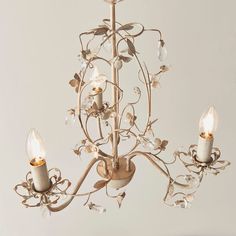 a chandelier with three candles in it