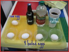 eggs are laid out on a lego tray with coffee, root egg, and boiled eggs