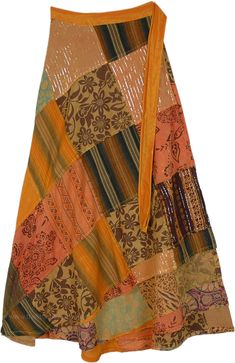 A beautiful citrus-colored wrap-around skirt - that reminds you of the sandstone and rocks you see in the grand canyon - is sure to make you feel confident and radiant.  The patterns are put together in an artistic fashion and the skirt is truly unique with patchwork with striped fabric and some with shiny tinsel, and yet others being floral. #tlb #WrapAroundSkirt #Patchwork #MaxiSkirt #Fall #Halloween #GypsyLongWrap Patchwork Skirt Pattern, Bridesmaids Outfits, Orange Clothing, Maxi Skirt Fall, Skirt Patchwork, Geeky Clothes, Floral Wrap Skirt, Artistic Fashion, Crazy Patchwork