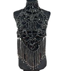 Introducing the Luxury Rhinestone Chain Shirt from Primadons and Donnas. This stylish and innovative shirt is sure to turn heads. It features a full rhinestone chain front and a halter style in the back. It's the perfect way to make a statement and stand out from the crowd. This shirt is made from high-quality materials and is designed to last. Plus, it ships in just 1 business day, so you can get it fast. So don't wait, get your Luxury Rhinestone Chain Shirt today and show off your unique style Glamorous Rhinestone Body Jewelry For Festivals, Glamorous Fitted Body Chain For Evening Events, Glamorous Fitted Body Chain For Evening, Festival Crystal Body Chain With Rhinestones, Elegant Crystal Body Chain For Festivals, Elegant Embellished Body Jewelry For Parties, Glamorous Evening Crystal Body Jewelry, Glamorous Beaded Body Jewelry For Evening, Glamorous Bling Body Jewelry For Evening