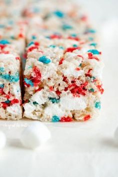 white cake with red, white and blue sprinkles on it's side