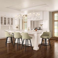 a kitchen with an island and bar stools in the center, surrounded by windows