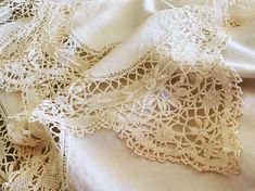 an image of some white lace on a bed