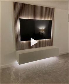 a large flat screen tv mounted to the side of a wall