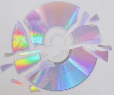 an image of a cd that has been cut into pieces