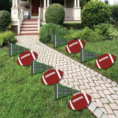 football yard decorations are set up in front of a house