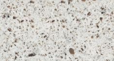 a close up view of a counter top with brown and white speckles