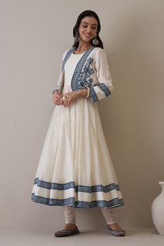 Off-white pure chanderi jacket with blue floral and resham embroidery. Comes with churidar and an anarkali. - Aza Fashions White Anarkali Dress With Embroidered Border, White Straight Kurta Dress With Embroidered Border, Cream Anarkali Set With Embroidered Border, Off White Anarkali Set With Embroidered Border, White Chanderi Dress With Embroidered Border, White Bohemian Anarkali Set With Dupatta, White Bohemian Anarkali Set With Long Sleeves, White Bohemian Embroidered Anarkali Set, White Anarkali Set With Embroidered Border For Navratri