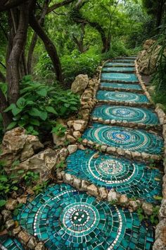 a set of steps made out of blue glass tiles in the middle of a forest