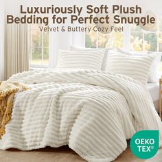 a white bed in a bedroom next to a window with the words luxury soft plush bedding for perfect snuggle velvet and butter cozy feel