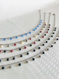 Here is the "Hanging Pearls" choker necklace collection. 🔥 Each bead is handcrafted by me. I work on glass bars in a very hot flame to shape the glass to suit your needs. It's called glass spinning Received idea : Glass beads are fragile: No! The spherical and small beads are very strong and bounce like marbles Practical information : 💧All metal elements are made of stainless steel. Thus, these jewels are not afraid of water and provide comfort and impeccable quality. 📏 The necklaces are adju Adjustable Glass Necklaces With Tiny Beads, Adjustable Glass Necklace With Tiny Beads, Polished Beads Choker Necklace For Gifts, Metal Necklaces With Polished Beads As A Gift, Silver Dangling Beads For Gifts, Silver Czech Glass Dangle Necklaces, Dangling Beads Choker As Gift, Czech Glass Dangle Necklaces As Gift, Adjustable Dangle Glass Necklace