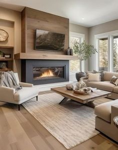 a living room filled with furniture and a fire place in the middle of the room