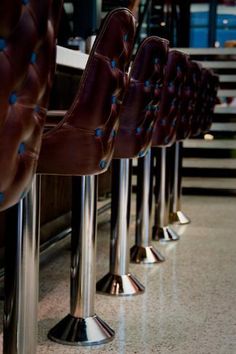 the chairs are lined up along the railing