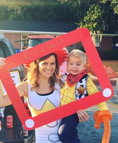 a woman and her son are dressed up in costumes