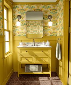 a bathroom with yellow walls and flooring has a mirror on the wall above the sink