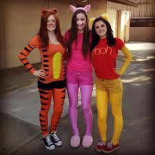 three women dressed up as winnie the pooh and tigger